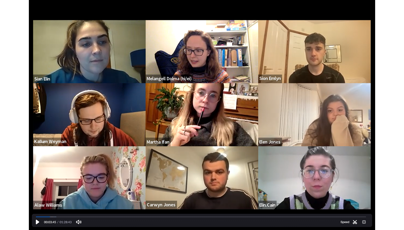 5.	Screenshot of a Zoom call with 9 individuals. All participants have their cameras on and are young people. One woman has her mouth open mid-conversation. 