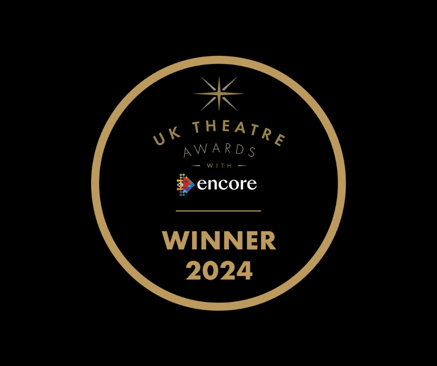 A black circle including the words UK Theatre Awards with Encore - WINNER 2024