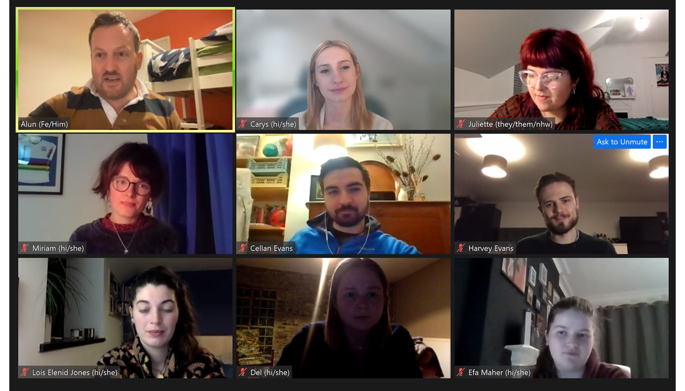 1.	Screenshot of a Zoom call with 9 individuals. Everyone has their camera on, and all participants apart from one are young people. One of the participants is a man older than the rest, he has his mouth open mid-conversation. 