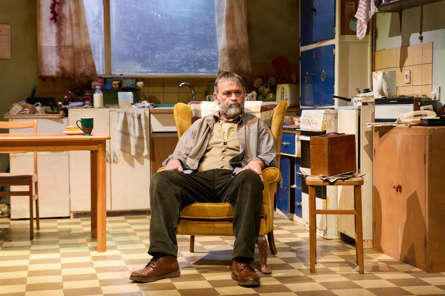 production image from huw fyw of a man sitting in an armchair